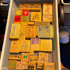 An assortment of rubber stamps, many brand new, for all occasions.